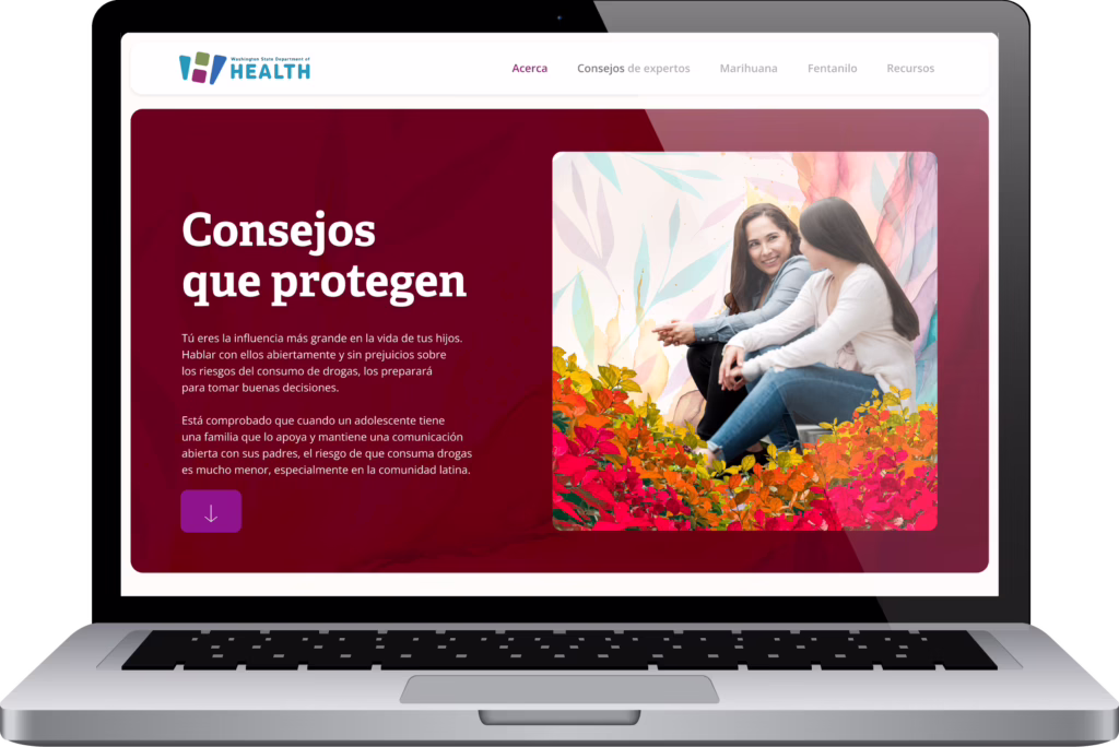 Website homepage shown on a laptop.